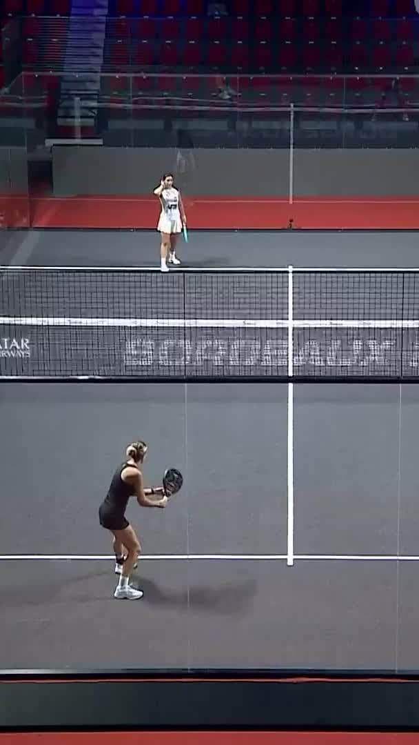 Velasco crunches an overhead smash